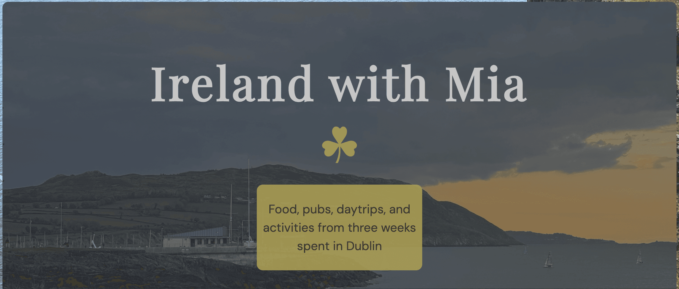 The Ireland with Mia travel blog's hero section, showing a dusky coastal harbor view with the site title and a 'food, pubs, daytrips, and activities' subtitle